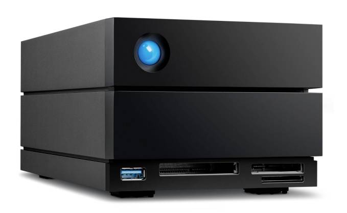 External hard drive with a black casing, identifiable by a bright blue button at the front. Visible ports on the front side.
