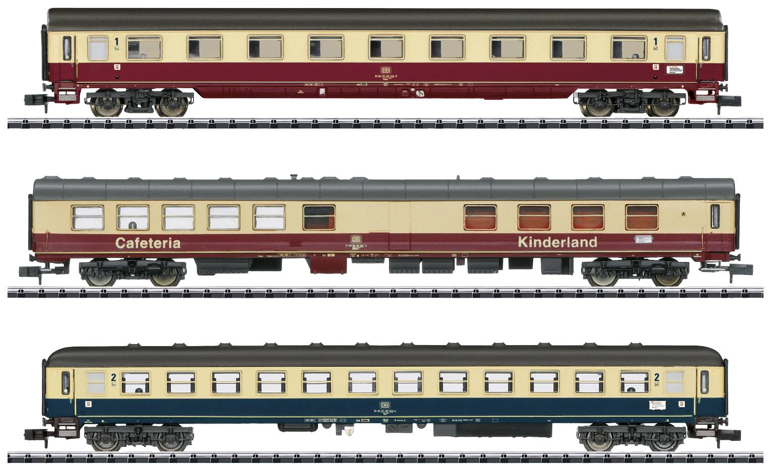 Three model railway carriages on tracks: Top and middle in red-beige with 'Cafeteria' and 'Kinderland' labelling, bottom in blue-beige.