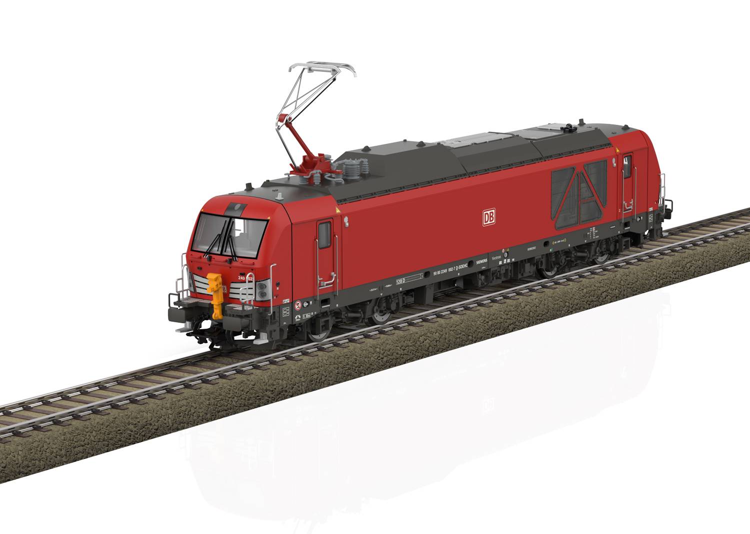 Red locomotive travels on a railway track, side view.