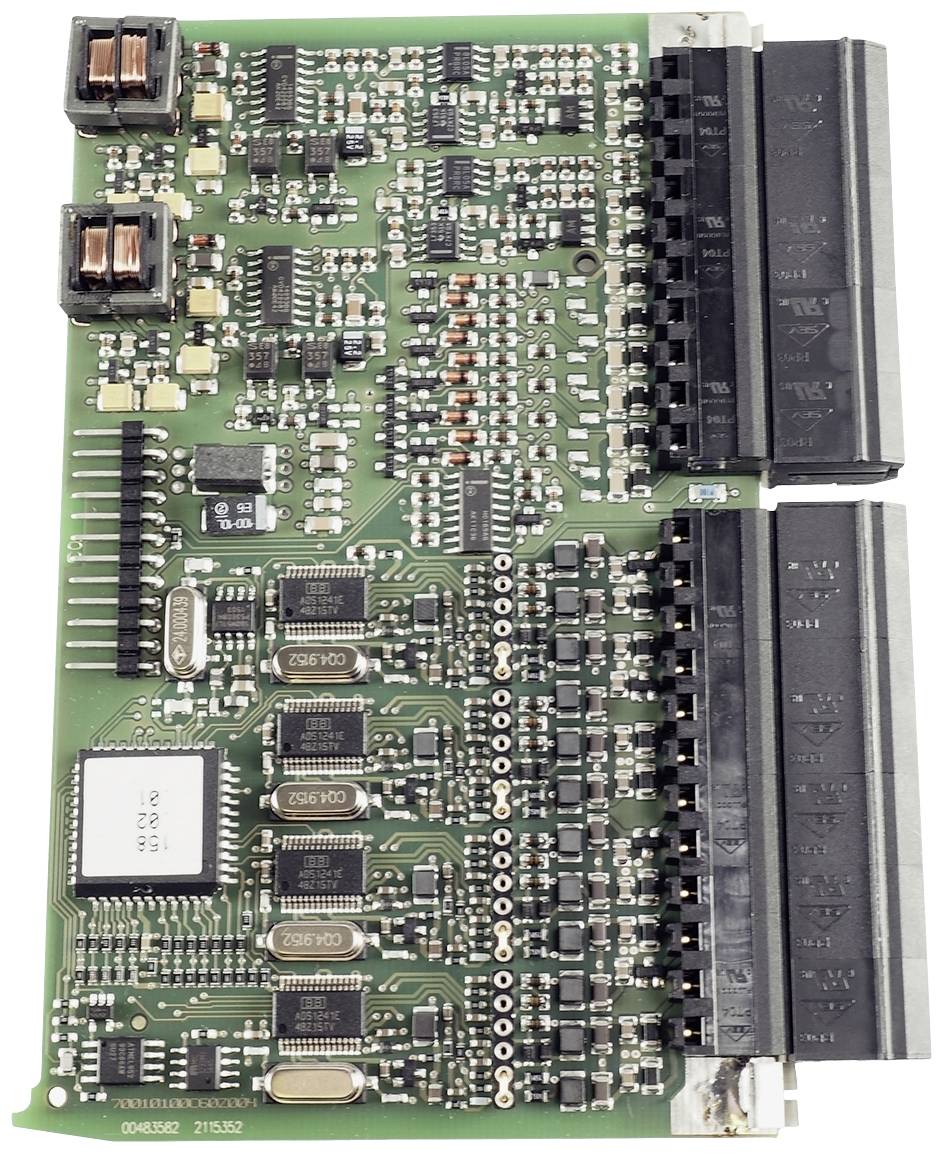Close-up of a circuit board with various electronic components and circuits, including chips and connectors.