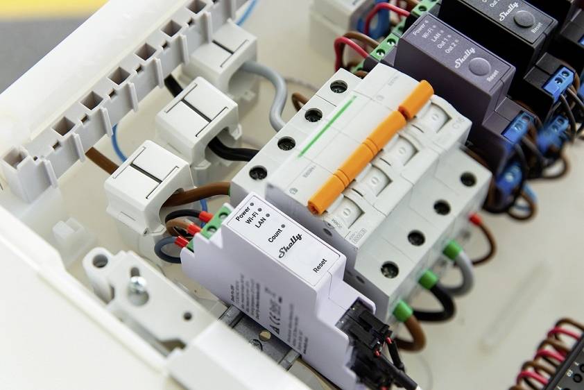 Electric consumer unit with multiple circuit breakers and wiring, showing a complex arrangement of specific electrical components.