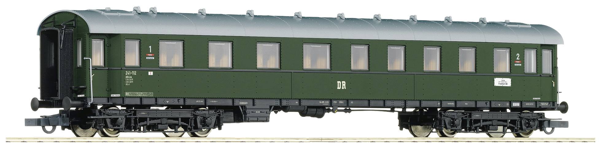 A green, historic railway passenger carriage on tracks. The carriage has numerous windows and is meticulously detailed.