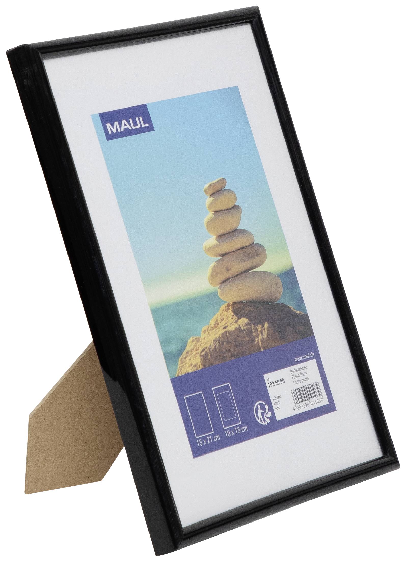 A black picture frame with a stand, standing upright. The frame contains an image of stacked stones on a beach.