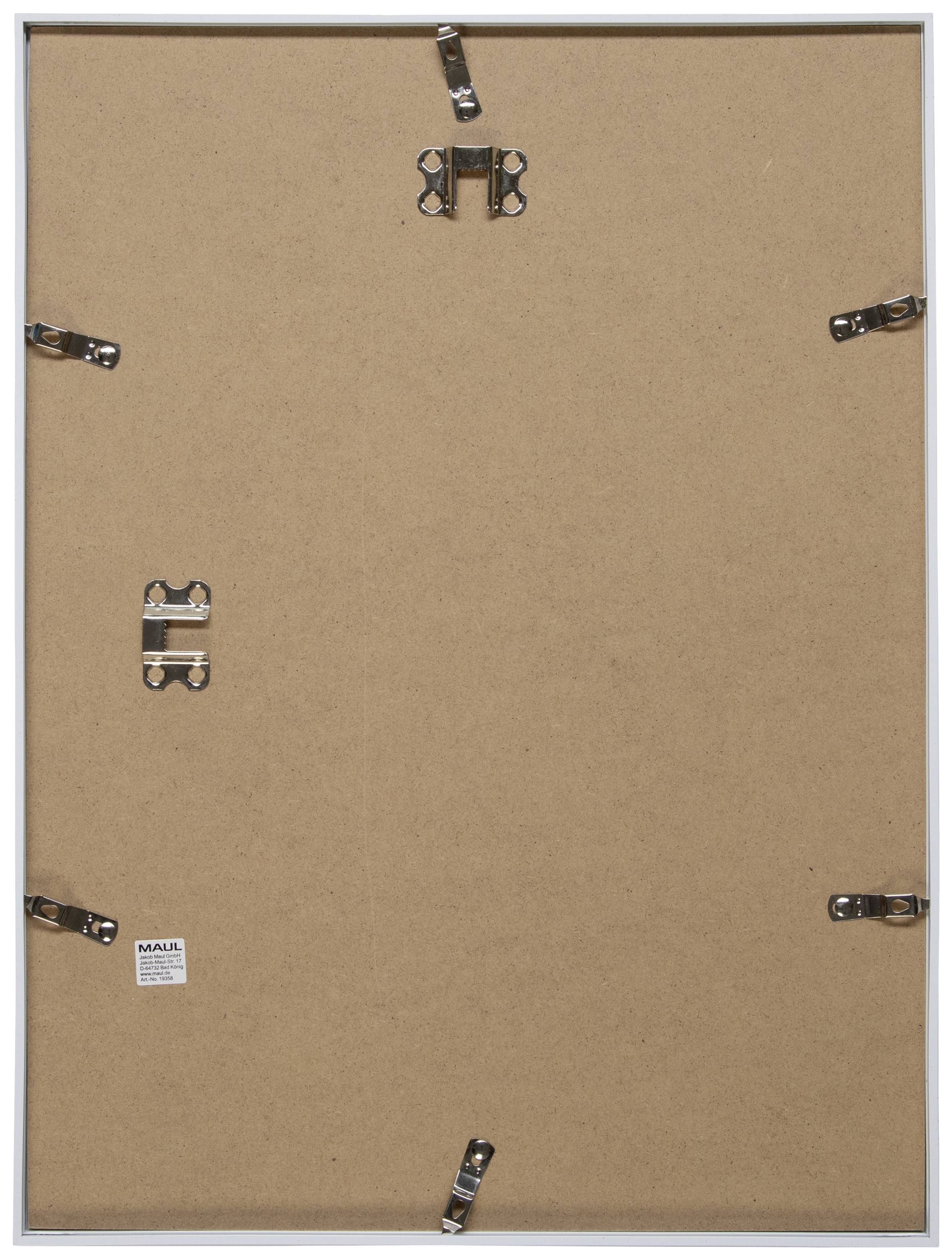 Back of a picture frame with several metal clips securing the backing board. A small label with text is visible.