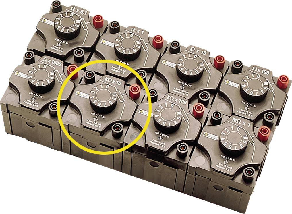 Nine black switches lined up; the middle switch in the bottom row is outlined in yellow.