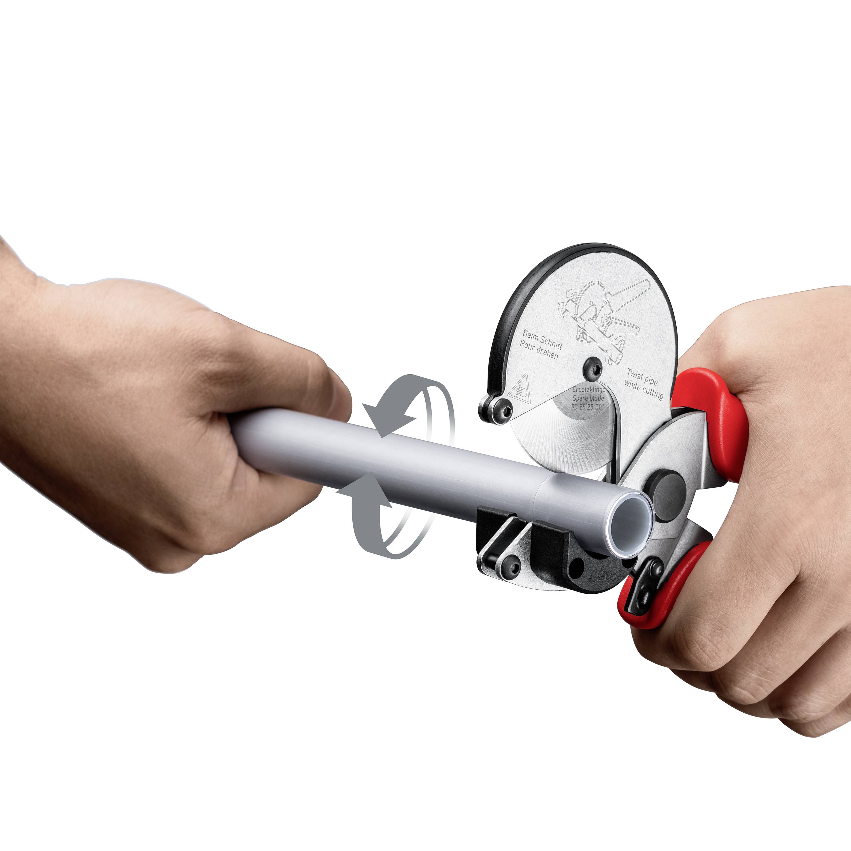 Two hands are using a pipe cutter to cut a plastic pipe. The right hand is pressing the handle of the cutter.