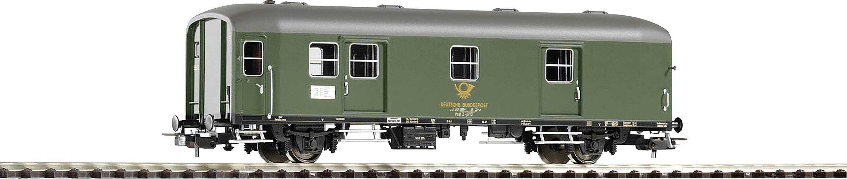 A green model railway goods wagon with four wheels on a section of track. The wagon bears the logo of the Deutsche Bundespost.