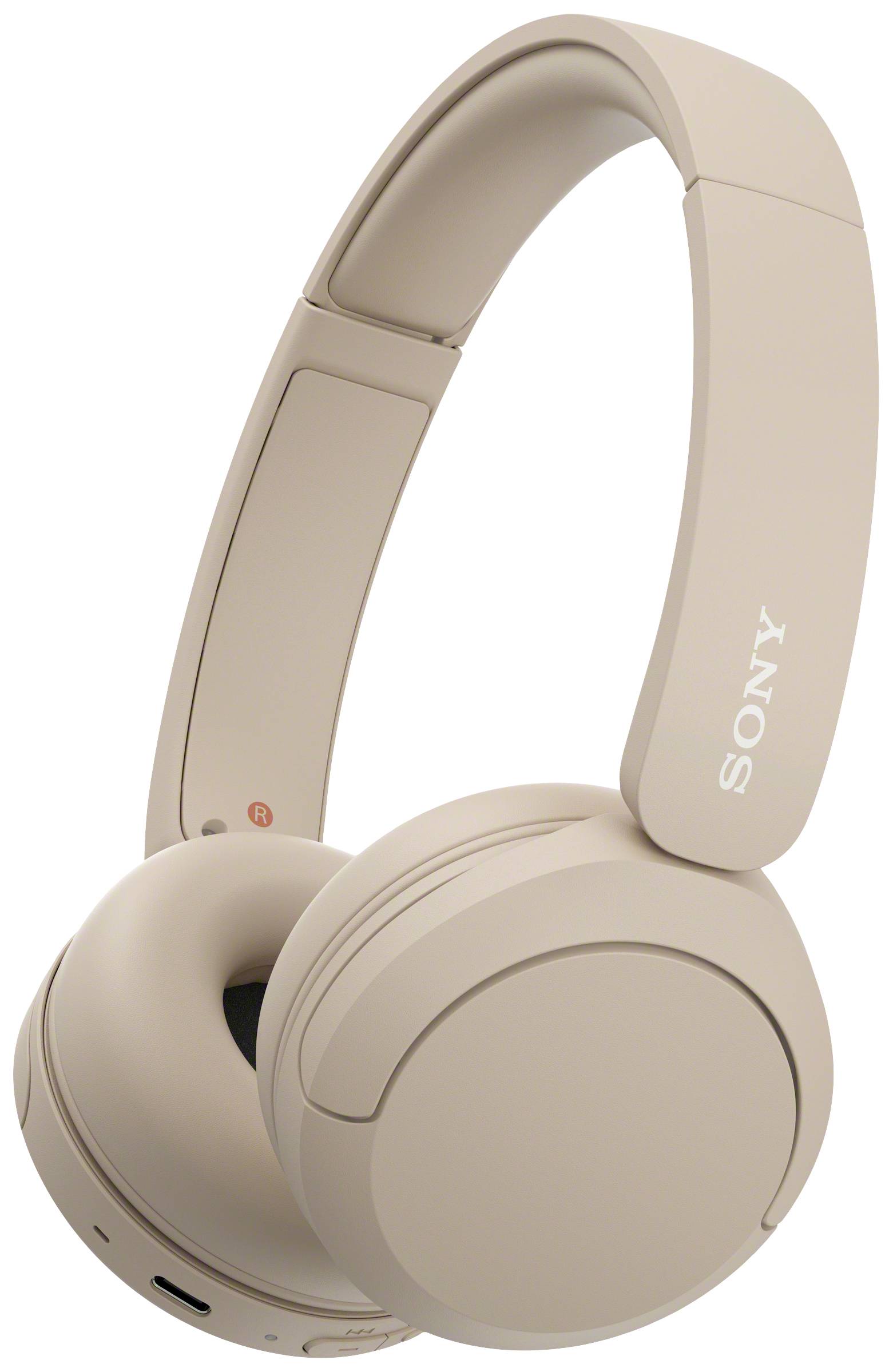 Wireless, beige over-ear headphones with brand logo on the side, against a white background.