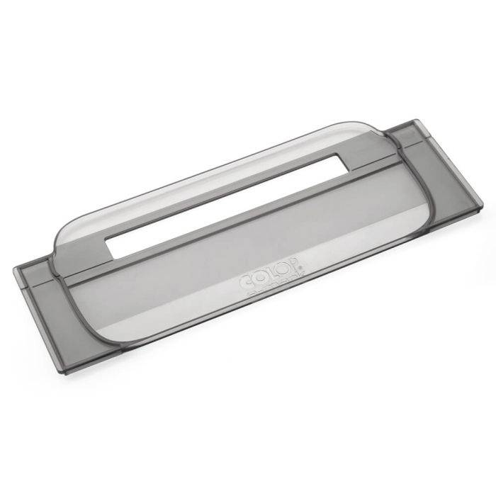 Transparent plastic cover with a rectangular opening and rounded corners, potentially part of an office stamp.