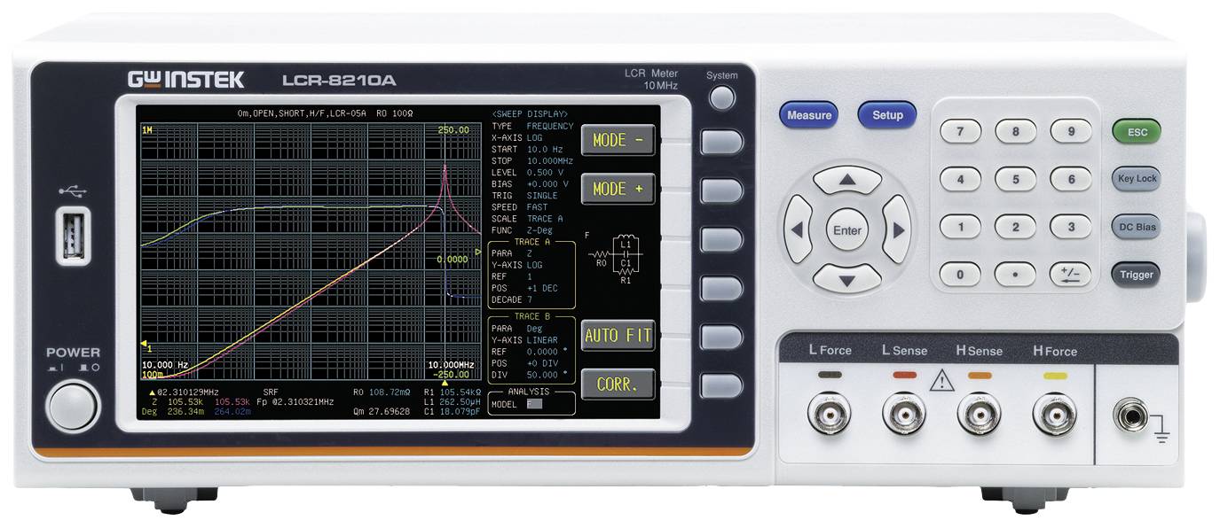 Measuring device with digital display showing electrical measurements and graphs. Control buttons located to the right of the screen.