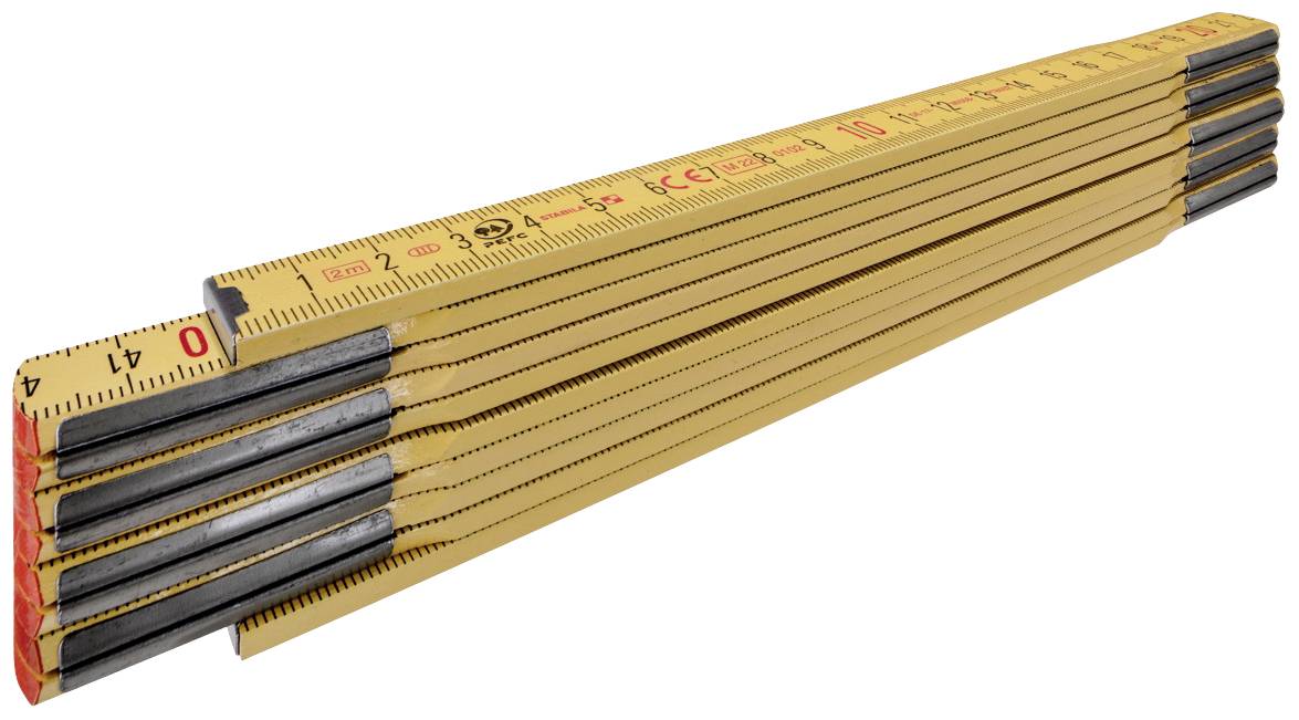 A yellow wooden ruler spread out on a surface shows the measurement divisions in centimetres.