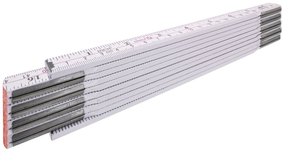 A white folding ruler with black markings and metal joints, laid out on a table.