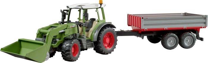 Tractor with front loader, attached two-axle trailer. Green with red wheels. Suitable for agricultural work.
