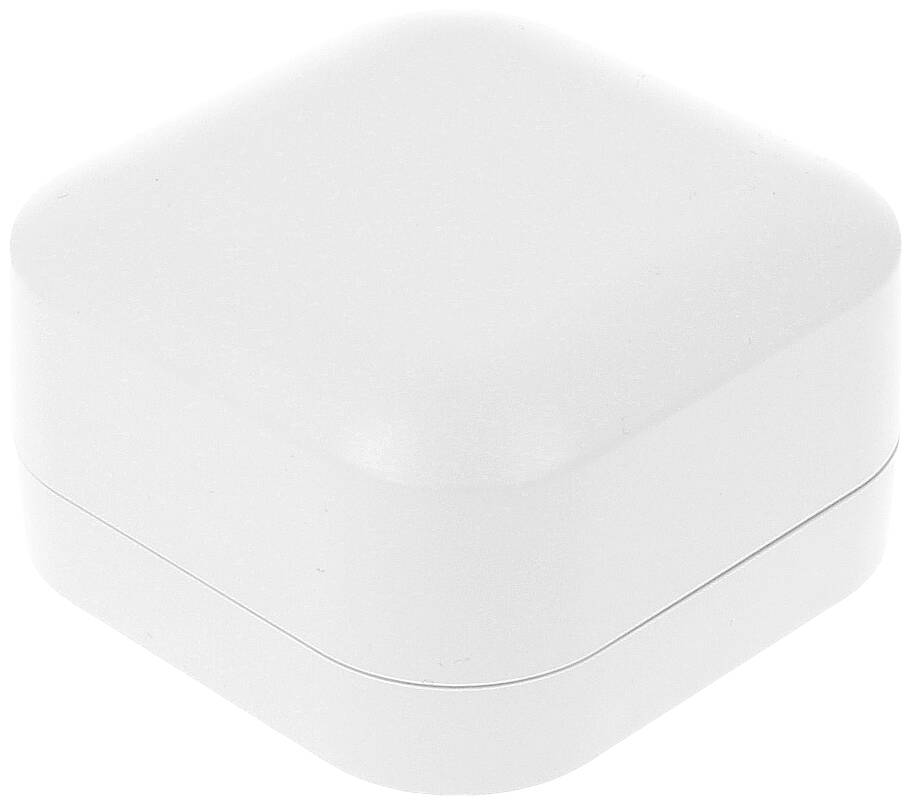 A square, white, closed plastic container with rounded corners.