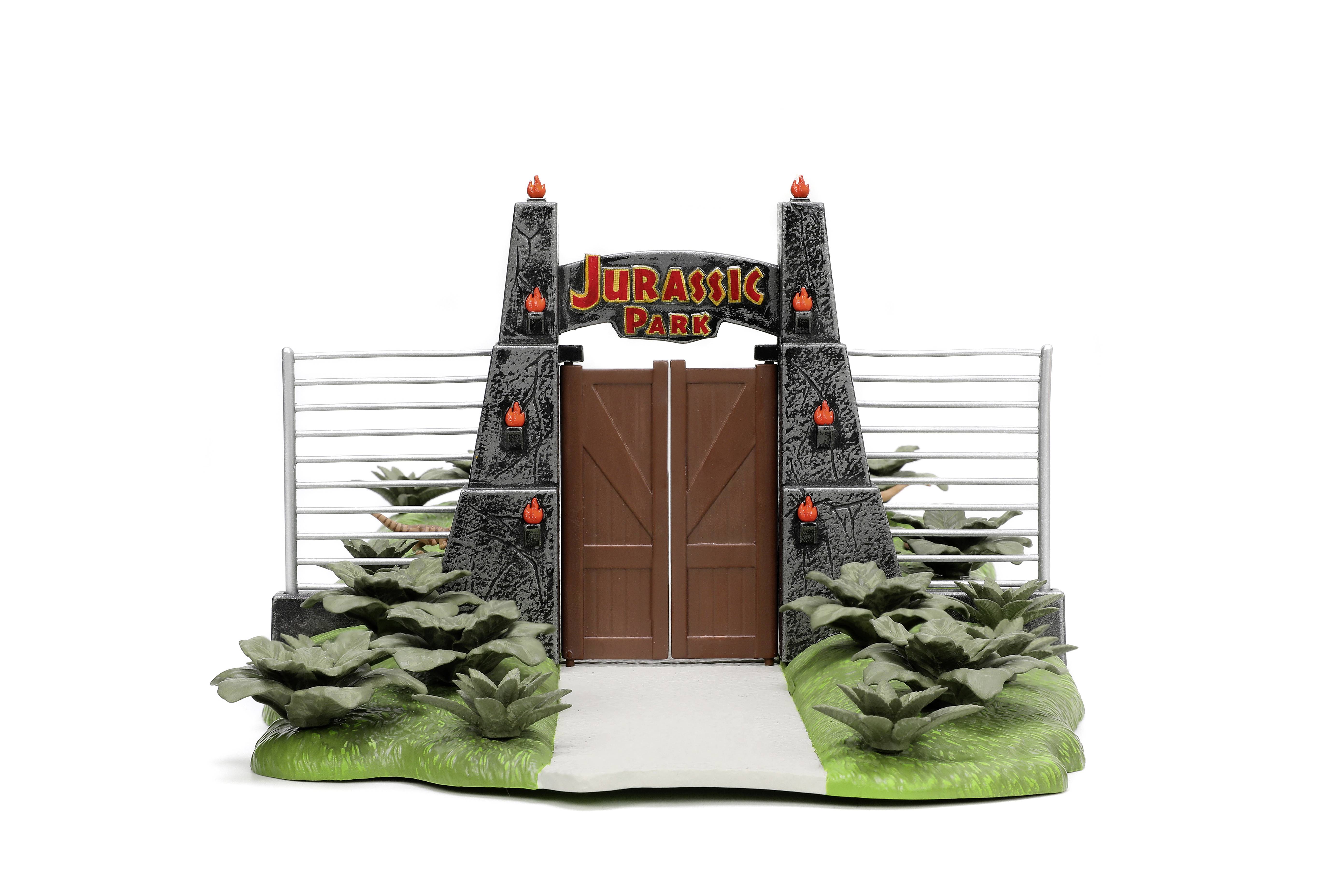 Entrance gate with a 'Jurassic Park' sign, flanked by plants and stone structures, symbolises adventure and dinosaurs.