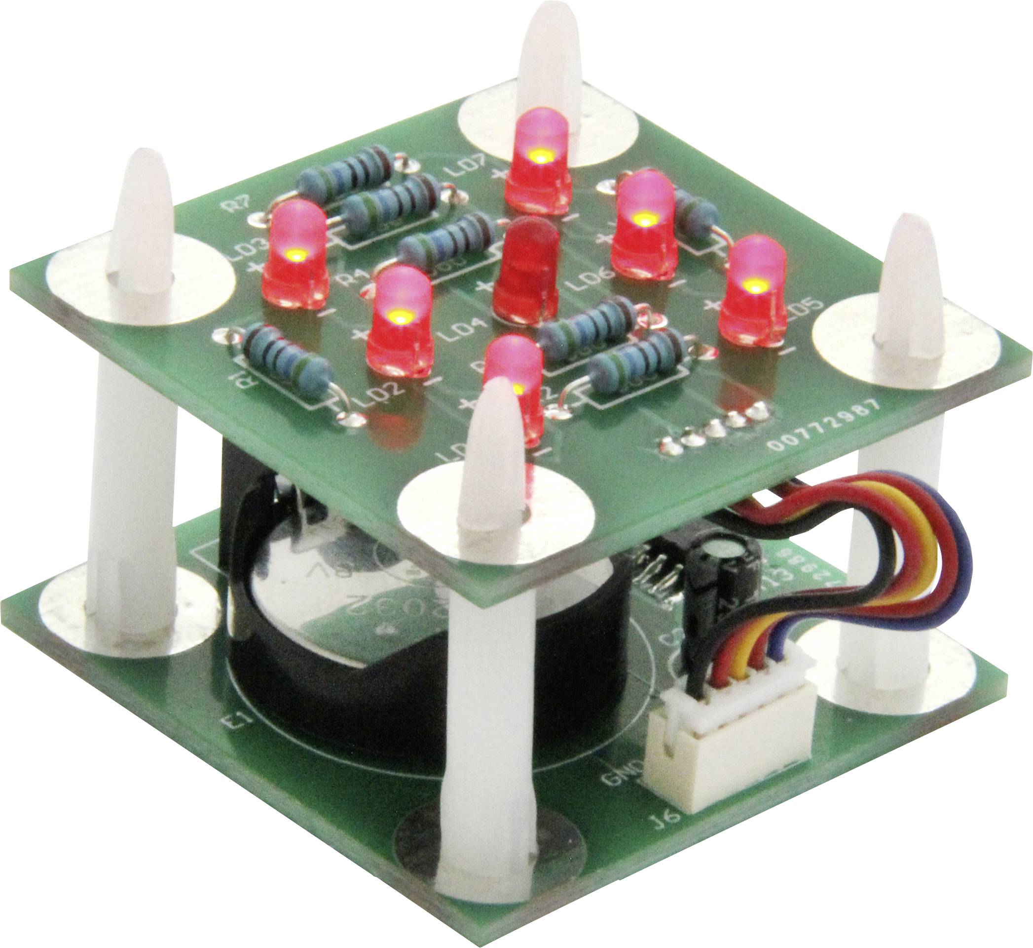 An electronic circuit with glowing red LEDs and resistors on a multi-layered green printed circuit board.