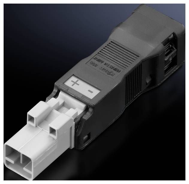 A black plastic adapter with a grey plug, marked with '+' and '-', on a dark background. Used for electrical connections.