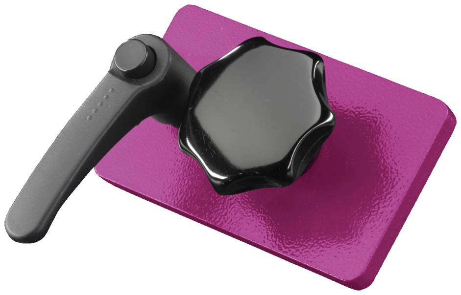 A black lever and rotary knob on a pink rectangular base.