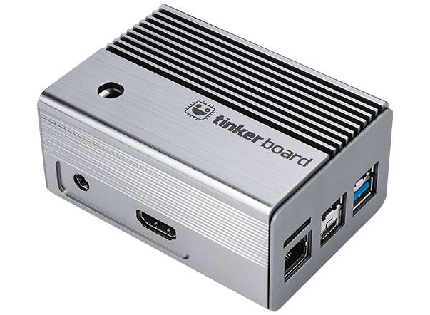 A silver enclosure for a single-board computer, viewed from the side. 'Tinker Board' logo at the top. It has ports for HDMI and USB.