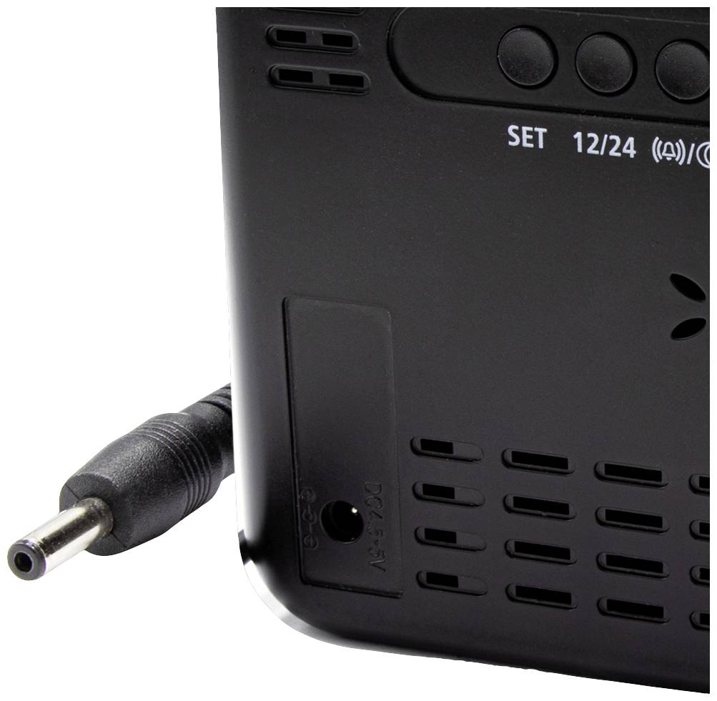 Rear view of an electronic device with power cable connection and control buttons for settings; shows details of ventilation openings.