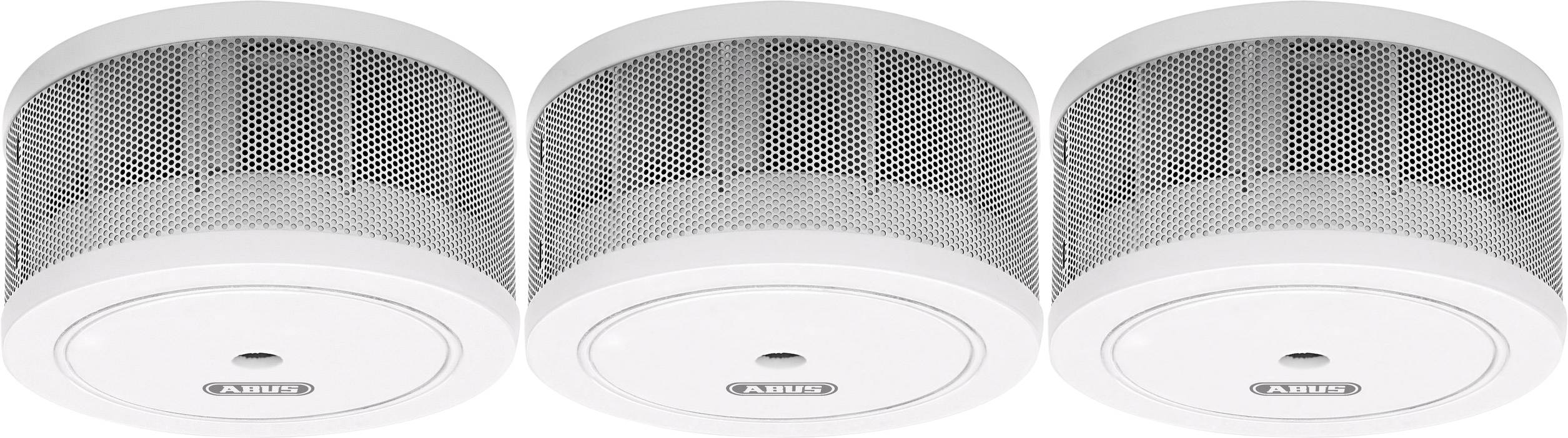 Three smoke detectors in a row, each device cylindrical with a white casing and grille.