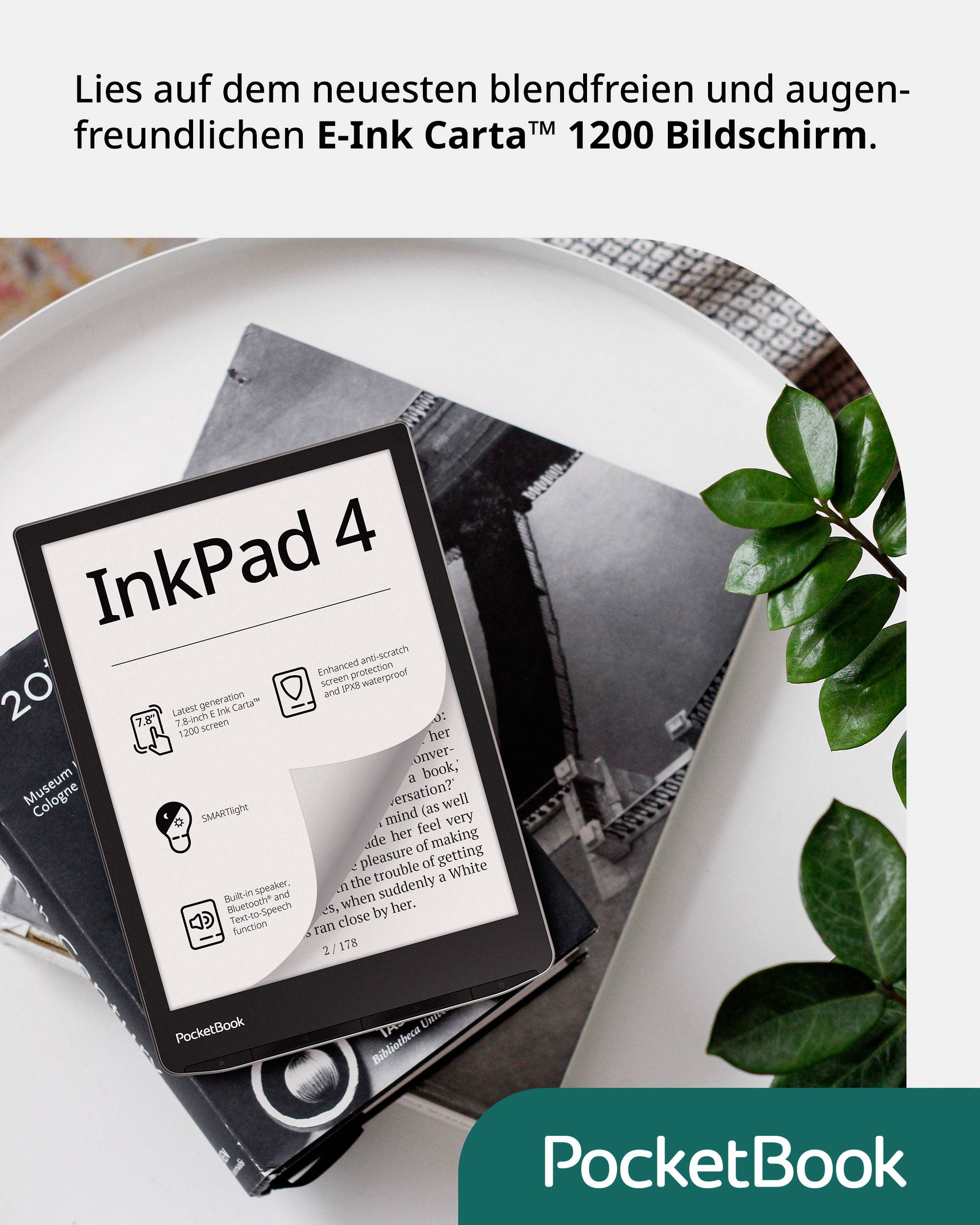 A PocketBook InkPad 4 e-reader sits on a table with open details displayed on the screen. A notebook and a plant are in the background.