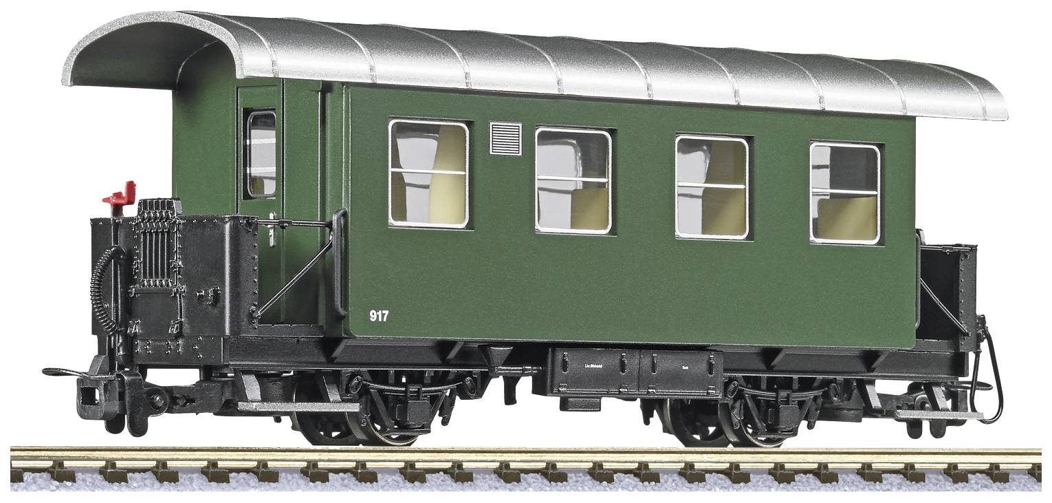 Green model railway passenger carriage with a curved roof and four windows, placed on rails.