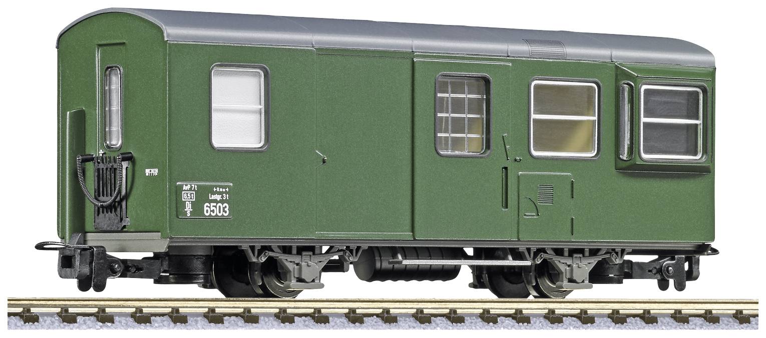 Green railway carriage on tracks in model railway scale, with windows and doors, detailed replica for model building.