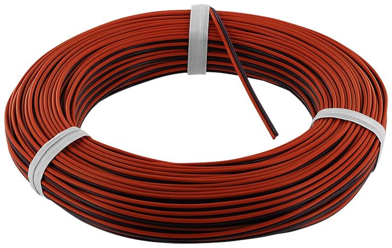 A large reel of red and black electrical cable, wound up and secured with two metal bands, lies on a white background.