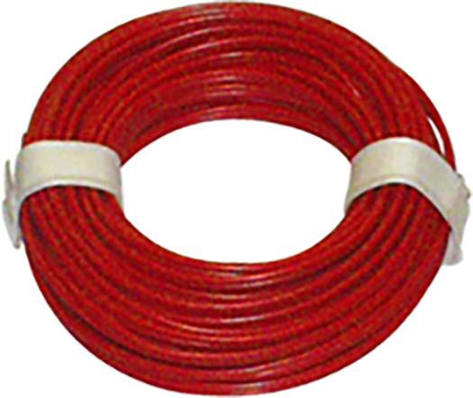 A red cable reel, carefully wound and secured with two white straps, rests on a flat surface.