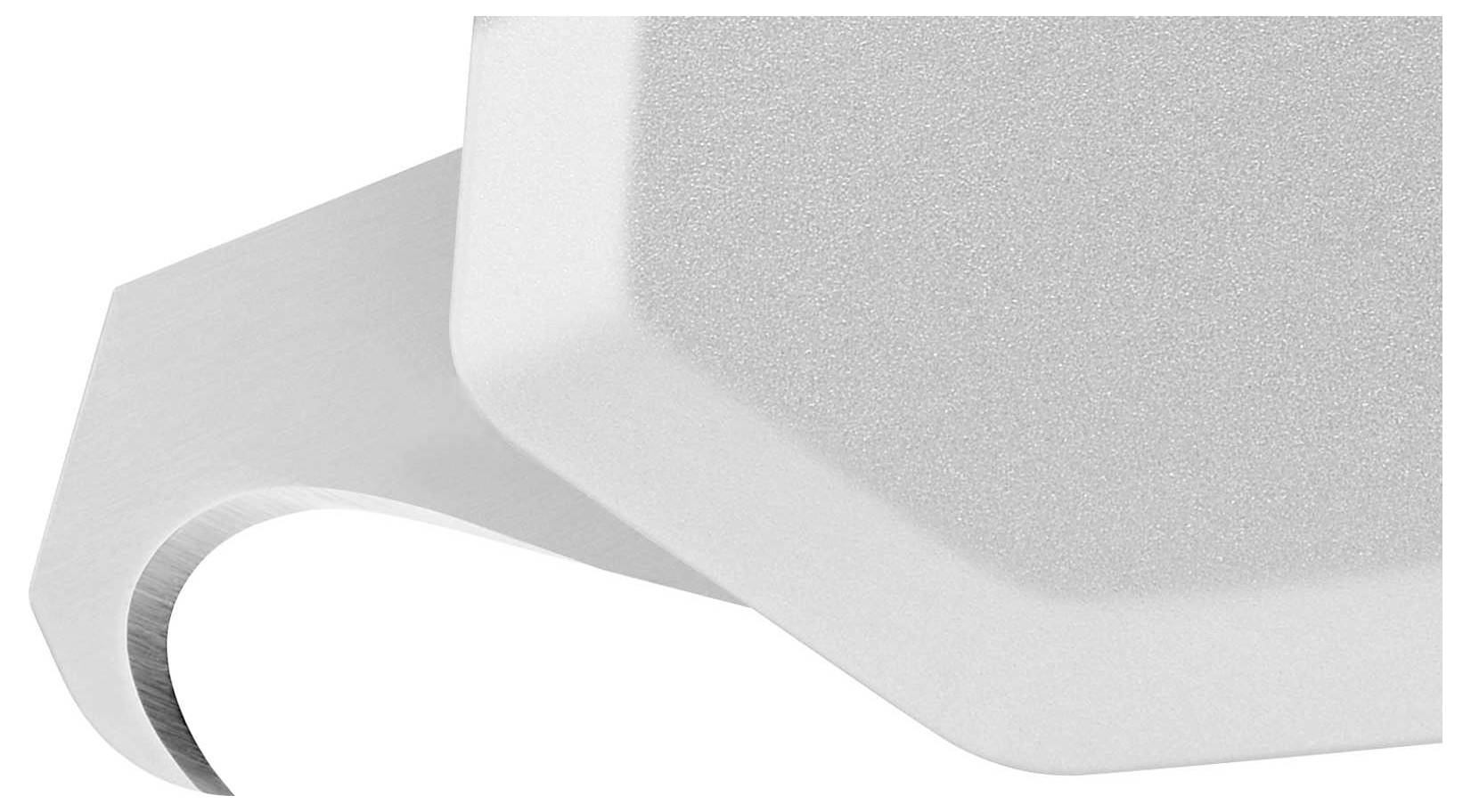 A white and grey, geometrically shaped object with a curved edge, shown greatly magnified.