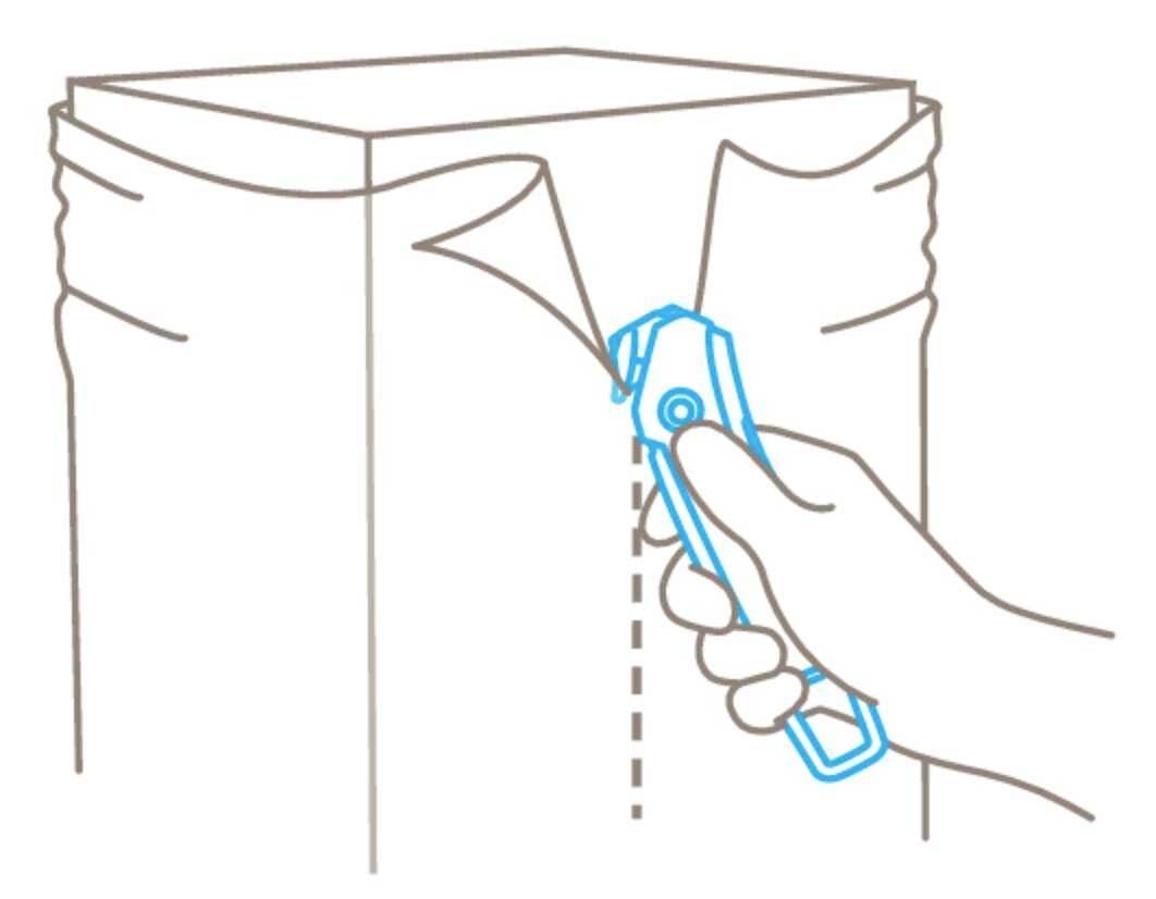 Illustration shows a hand cutting open a sealed package along the marked line with a utility knife.