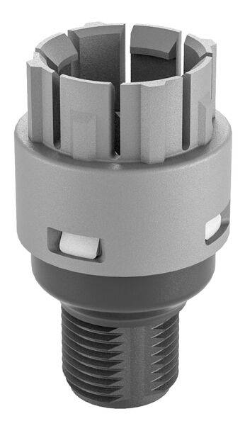A silver mechanical engineering component with a cylindrical shape and multiple rectangular recesses on the top surface.