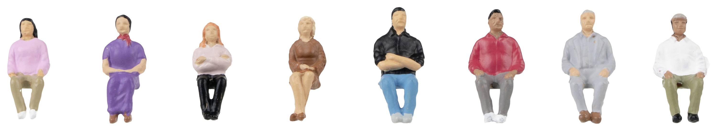 Eight colourful miniature figures positioned in various seated poses. They wear different clothing and colours.