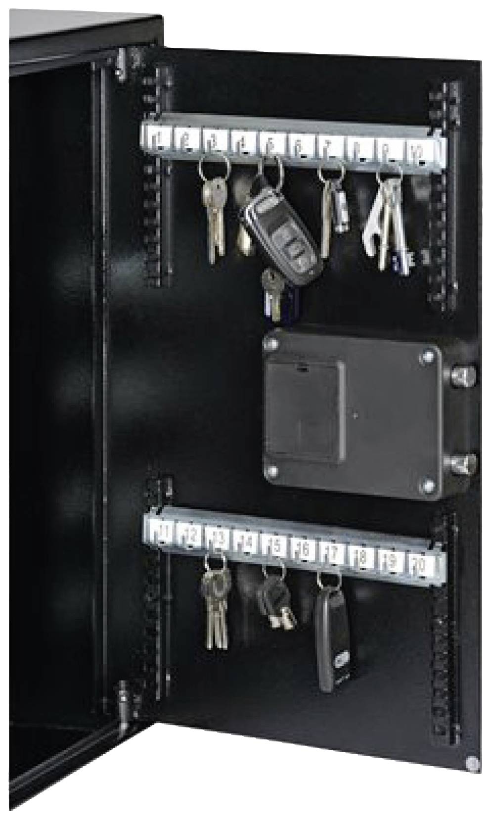 An open key cabinet with multiple key fobs and numbered hooks. A car key is hanging at the top.