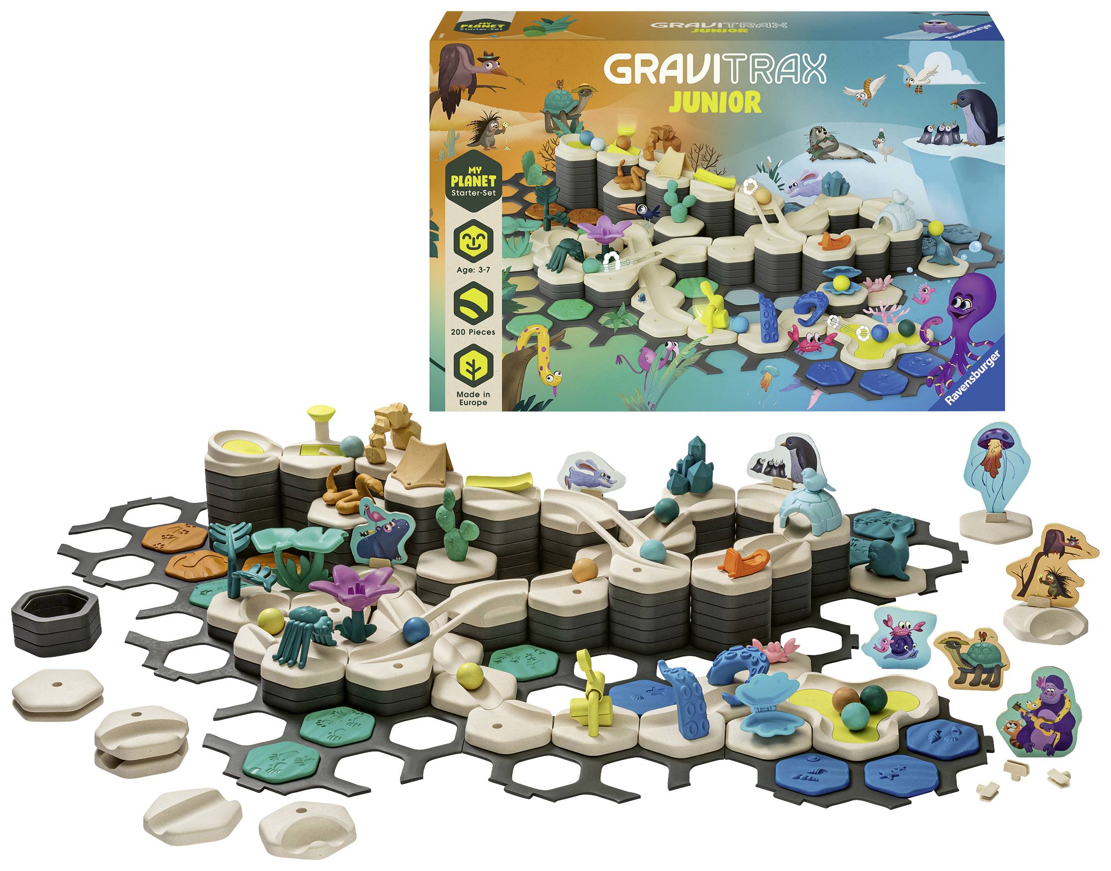 A GraviTrax Junior play set with various track elements and figures. In the background, you can see the colourful packaging.