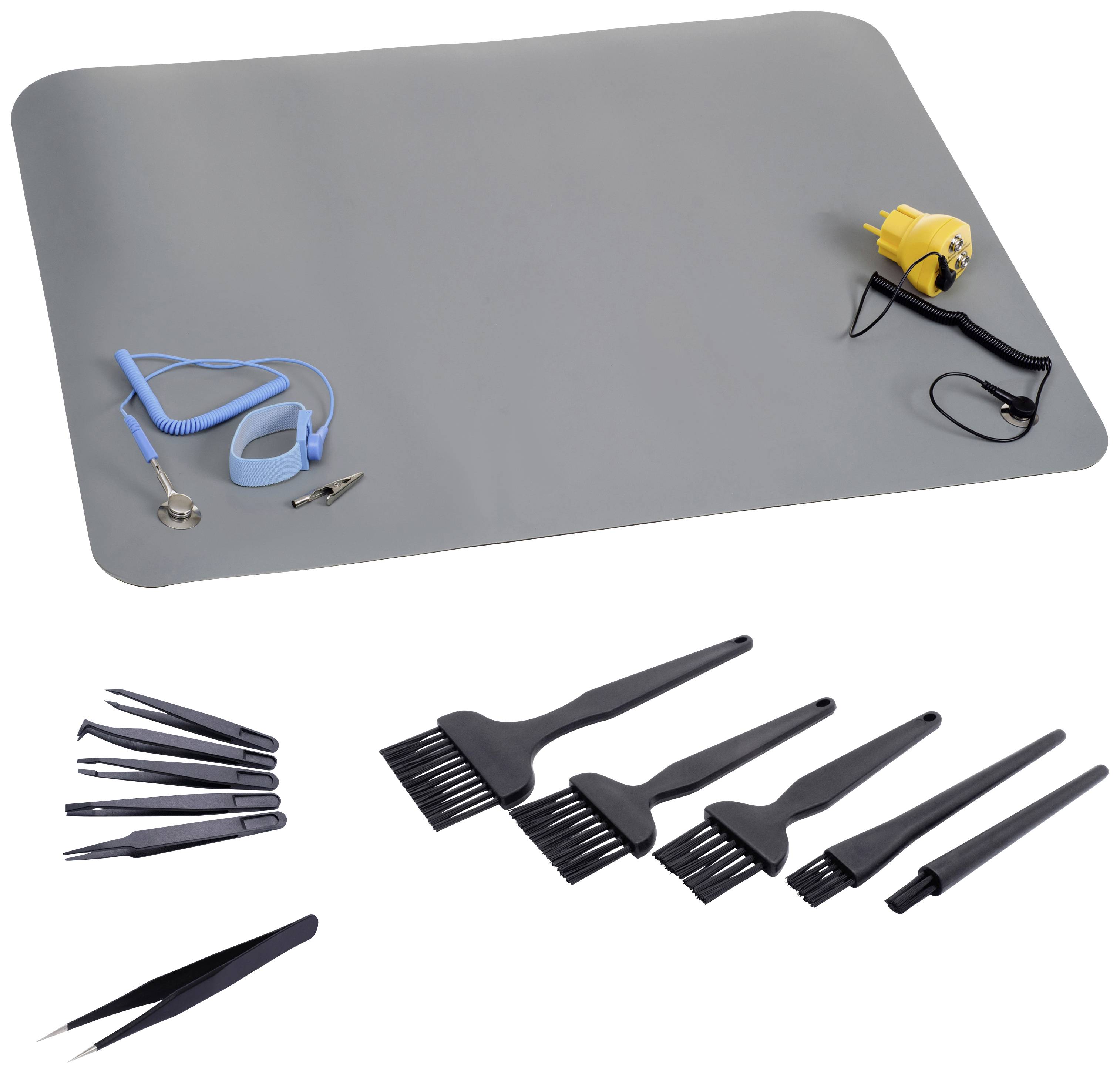 Hairdressing supplies set with hair clippers, brushes, clips and protective mat. Suitable for professional haircuts.