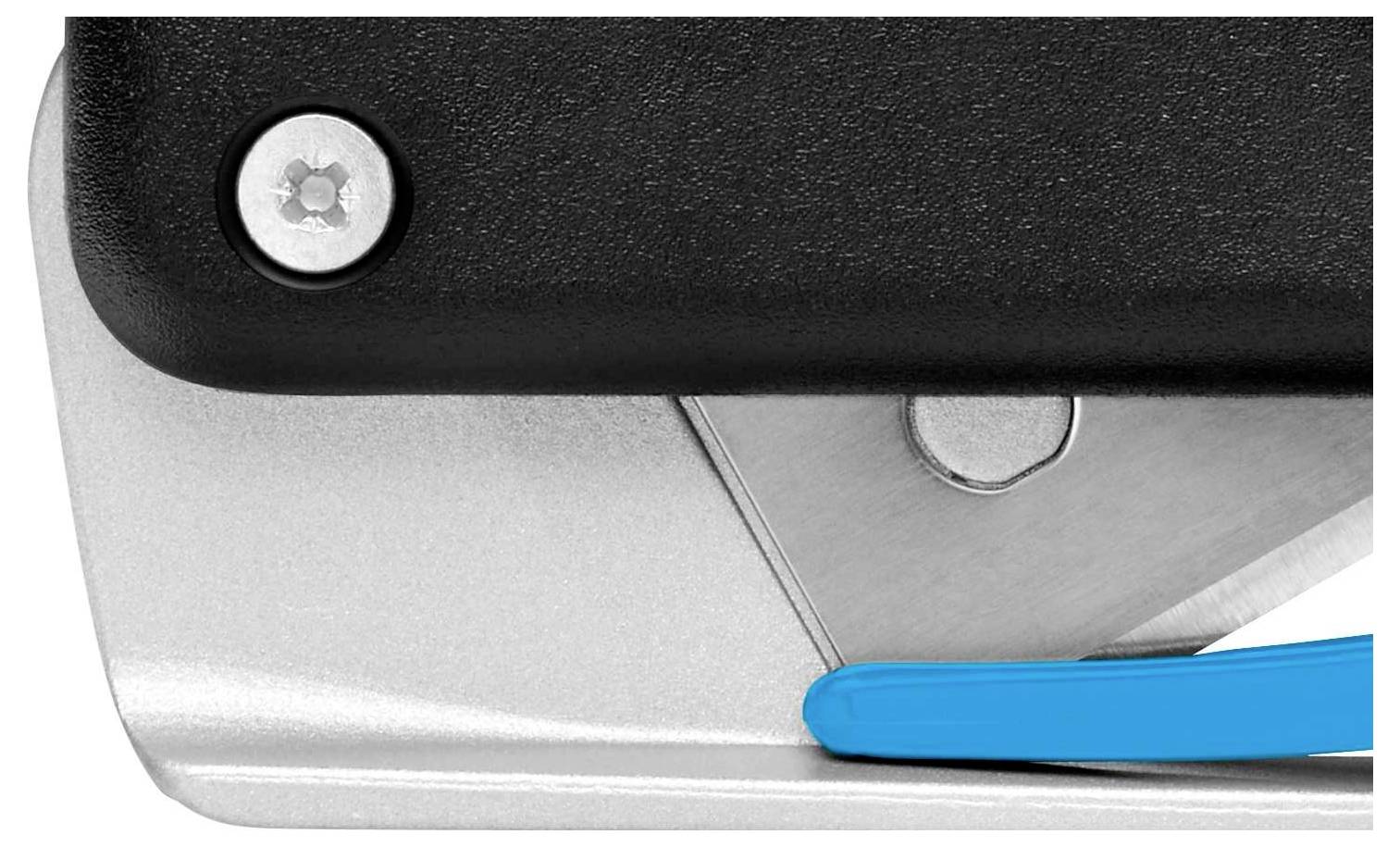 Close-up of a black and silver tool with a blue lever, possibly a stapler or hole punch.