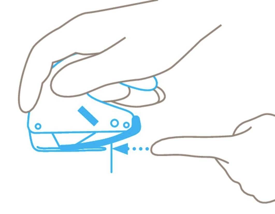 A hand is holding a staple gun and pressing it. A finger is pointing at the stapled area.