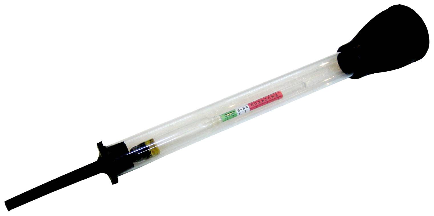 A transparent fuel tester with a black rubber bulb at the end, for measuring fluid density in vehicles.