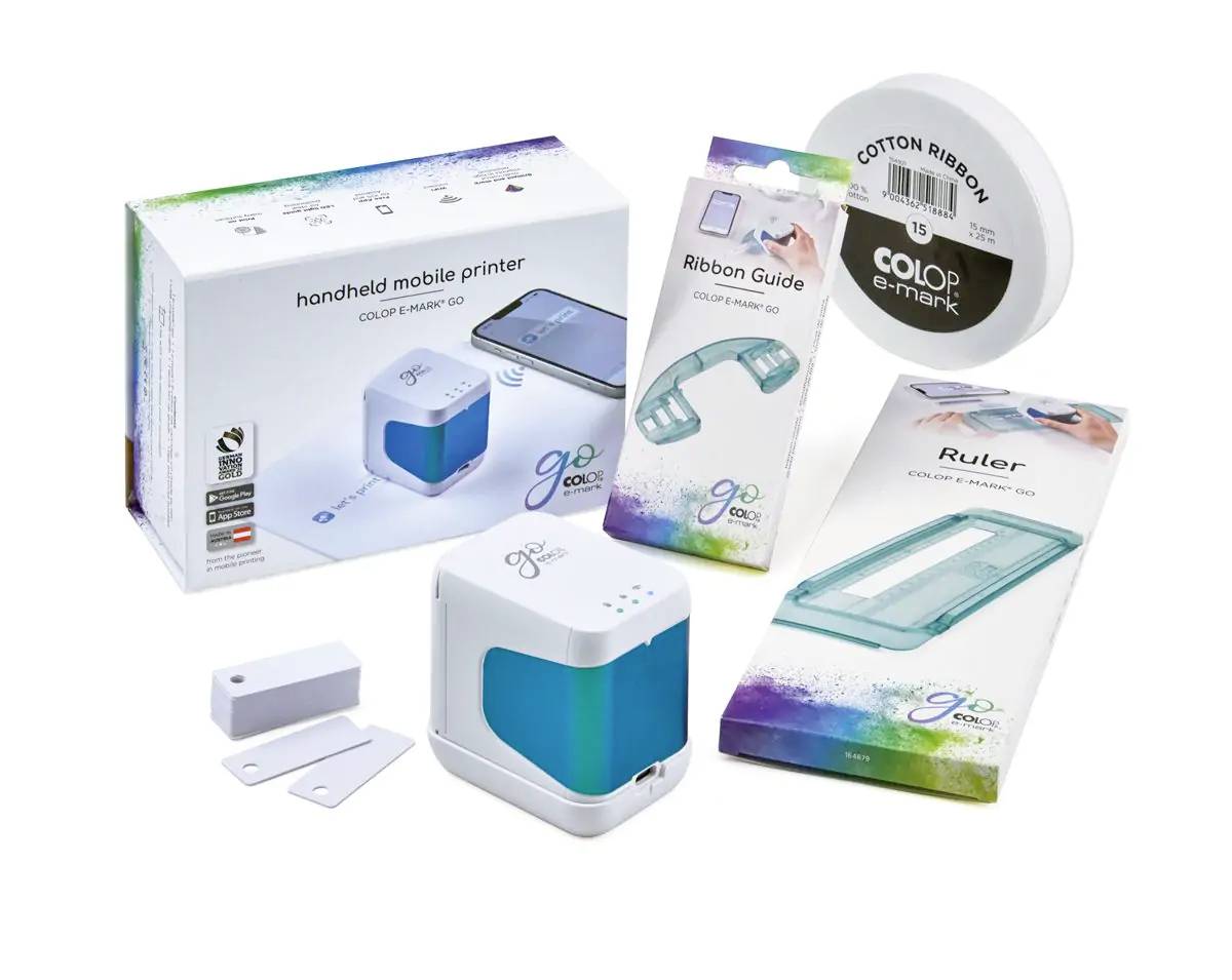 Packaging of a portable mobile printer with accessories: Manual, ribbon guide, ruler, and cotton band.