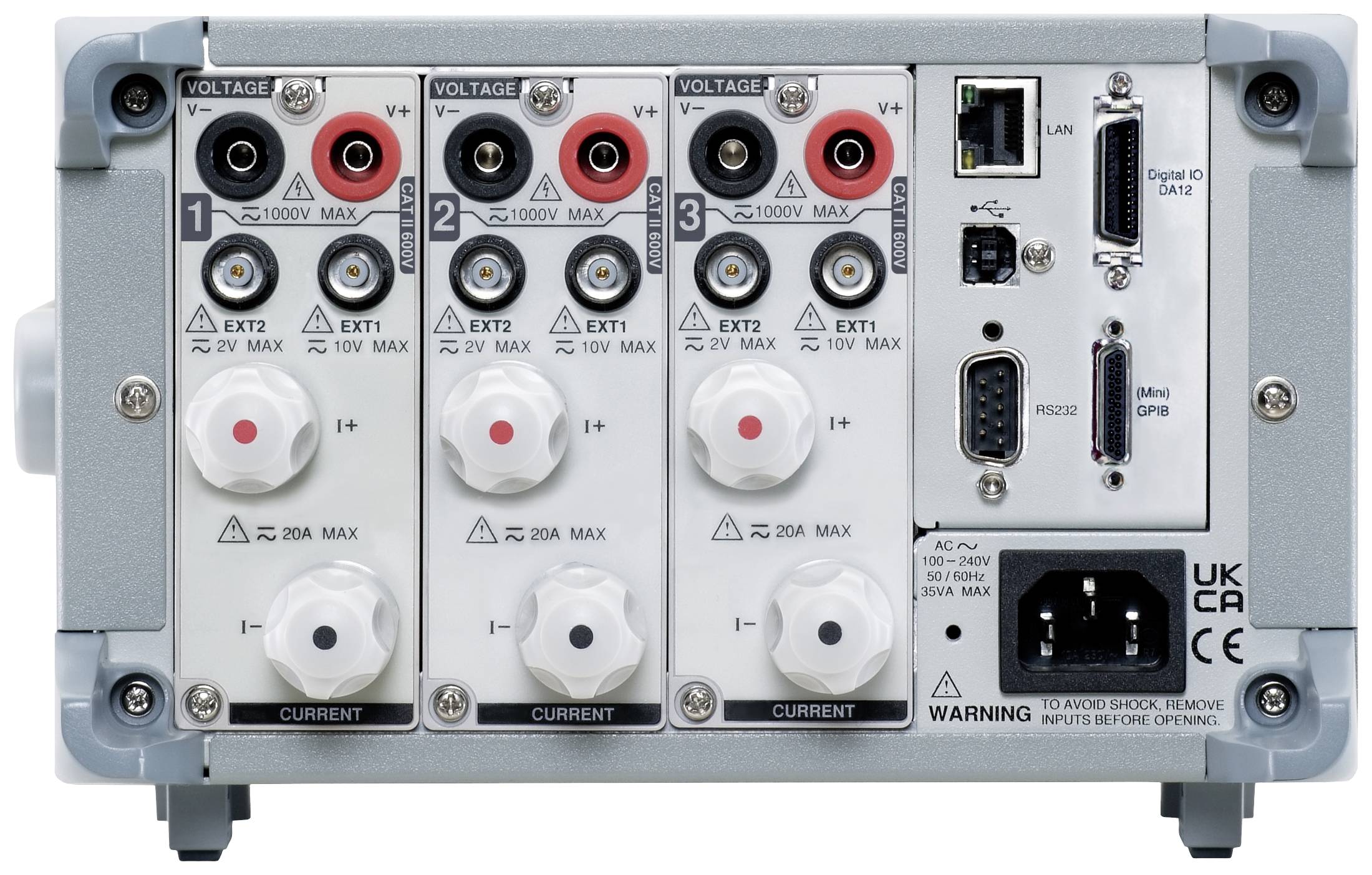 Rear view of an electrical measuring device with multiple connections, controls, and warning labels indicating maximum voltage and current.