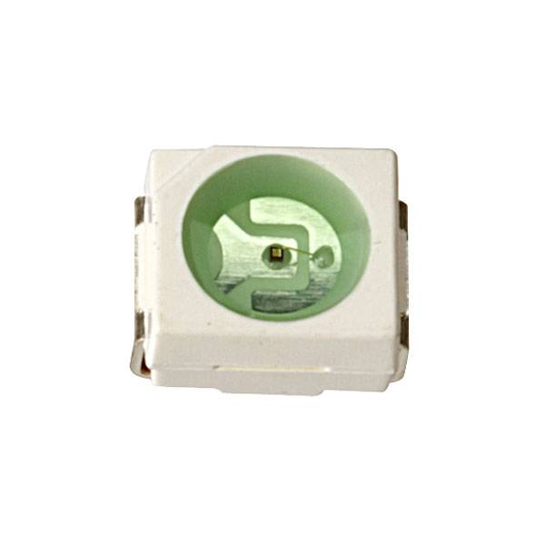 A small, square, white electronic component with a central green recess, likely an LED indicator.