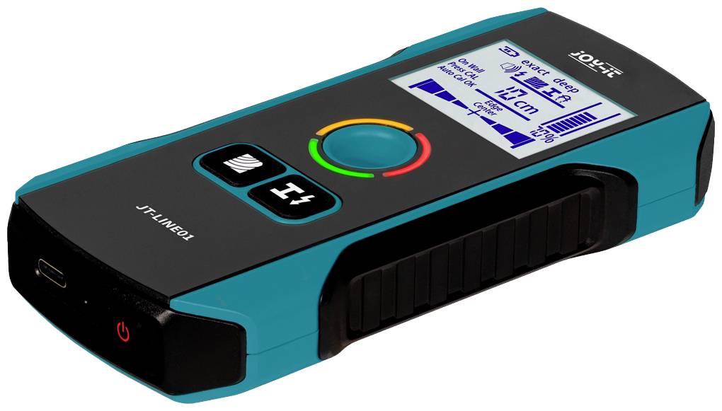 A blue-black digital detector with a display shows the bar graph representation of electrical cables and metal objects.