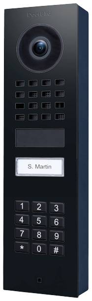 A black door intercom system with camera, microphone, speaker, and keypad. Labelled 'S. Martin'.