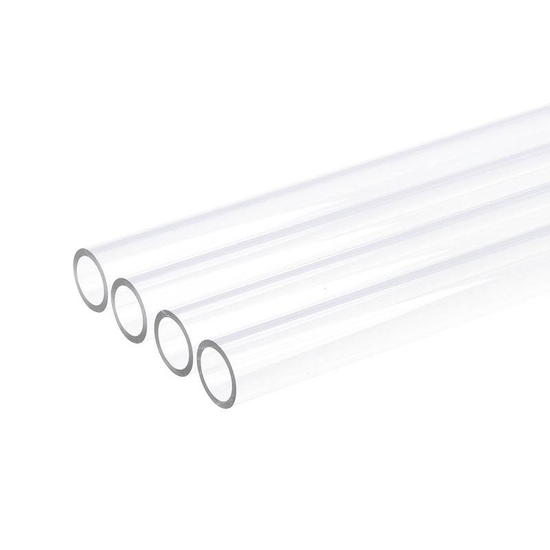 Transparent plastic pipes lying parallel to each other against a white background.