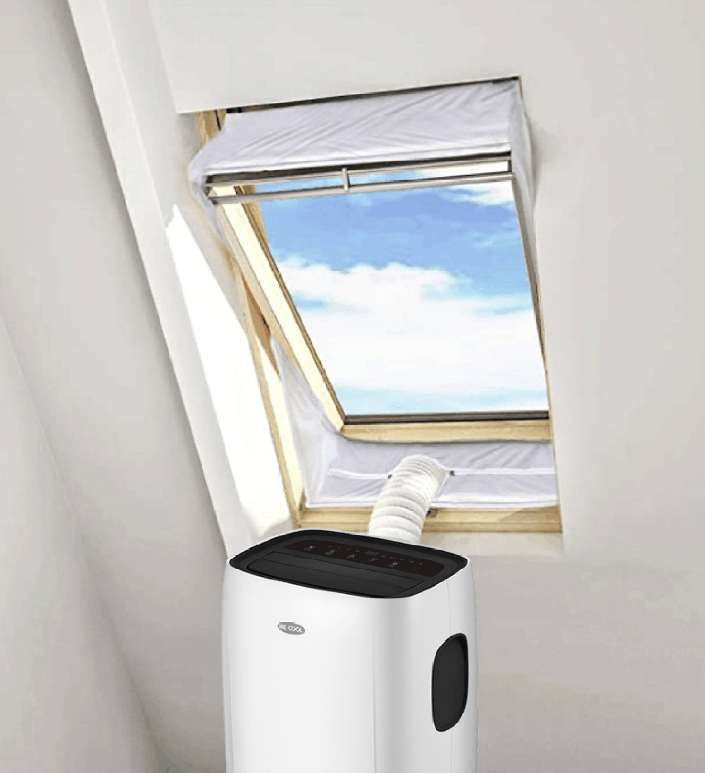 A portable air conditioning unit is ventilated through a partially open roof window. The sky is blue with a few clouds.