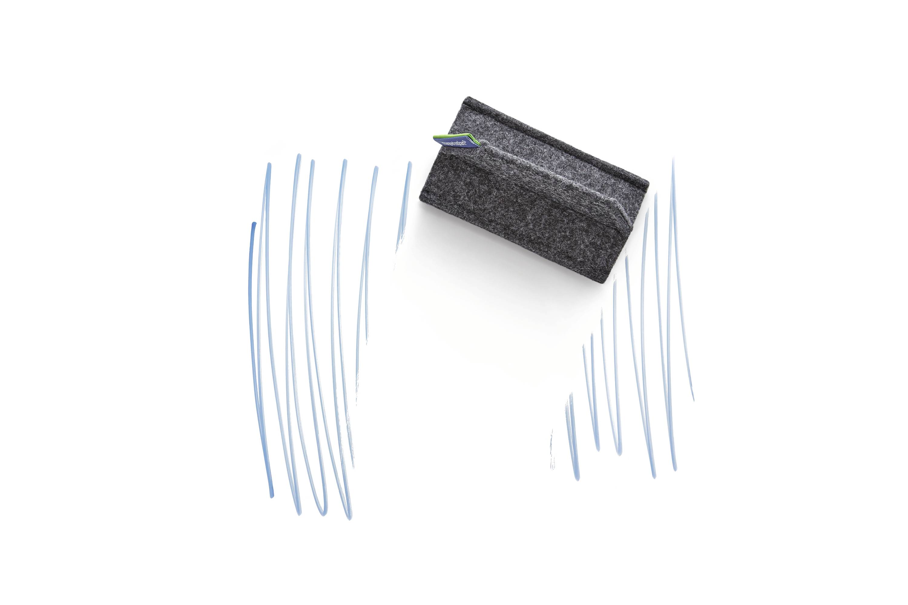 A black board eraser wipes blue chalk markings from left to right across a white surface.