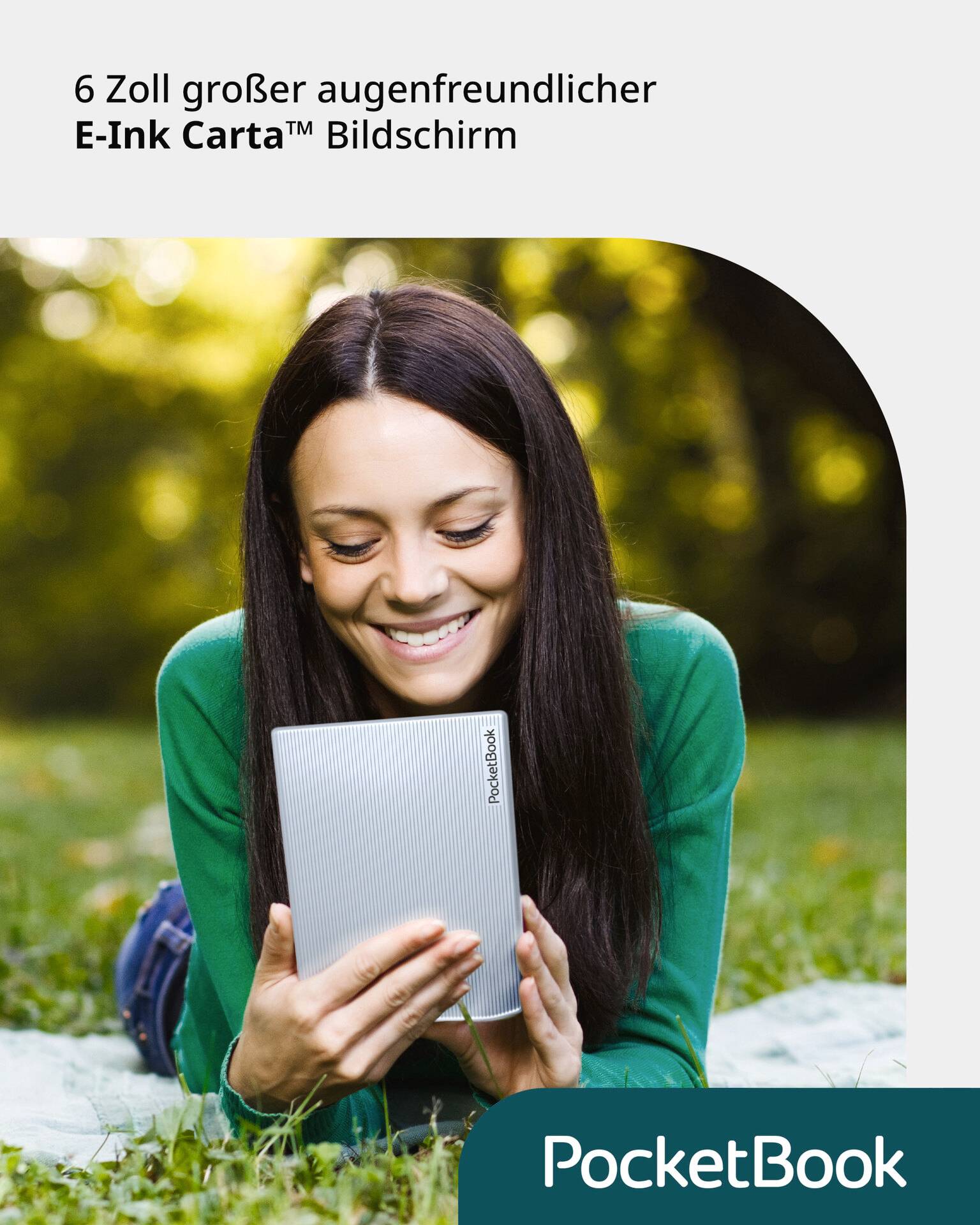 A woman is lying on a meadow reading on an e-reader with a 6-inch E-Ink Carta screen.