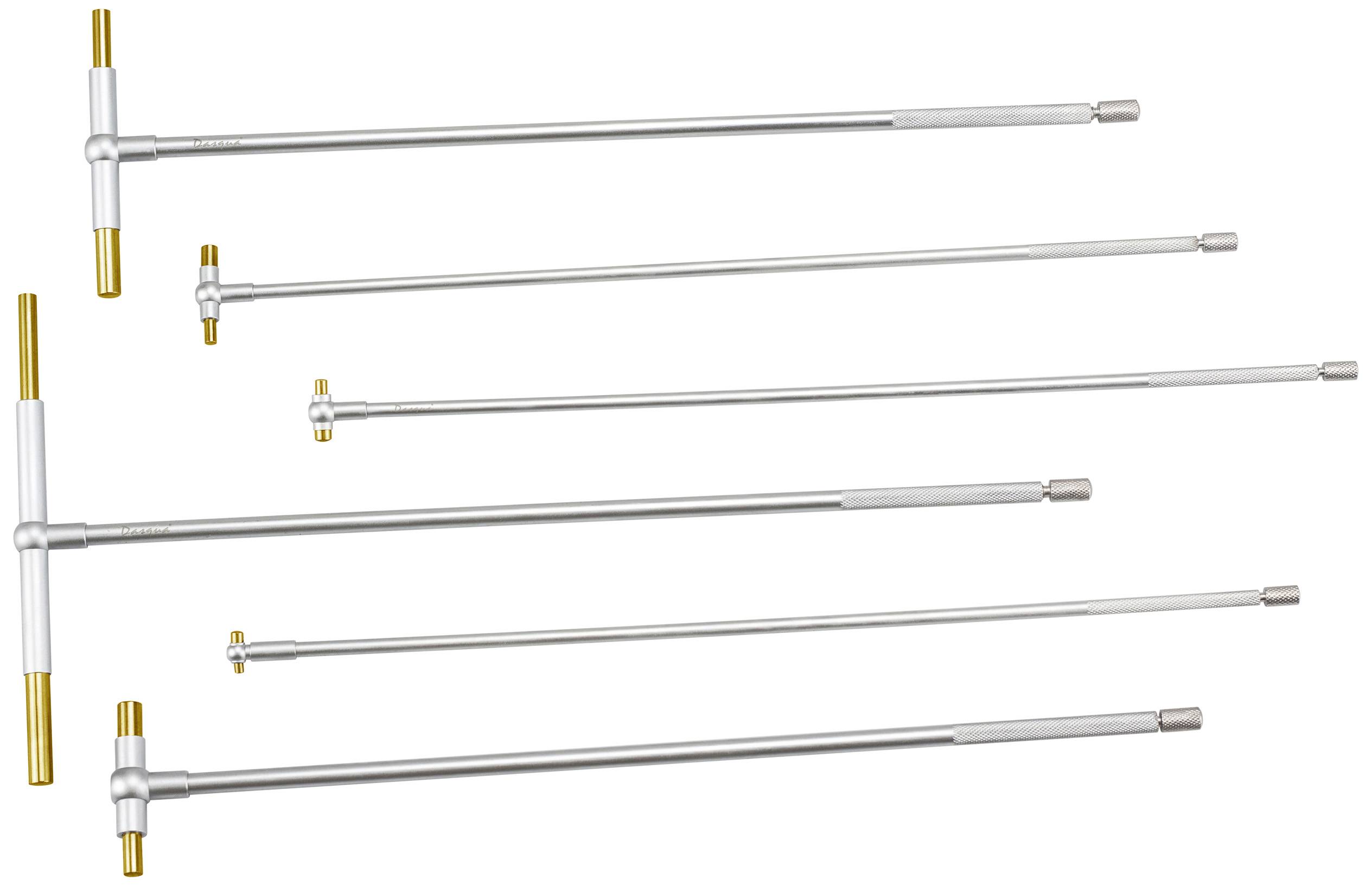 Six differently-sized silver and gold torque wrenches, lying parallel to each other, against a white background.